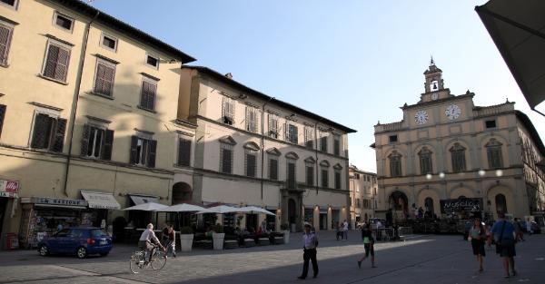 view of Piazza Matteotti in Città di Castello, with passers-by